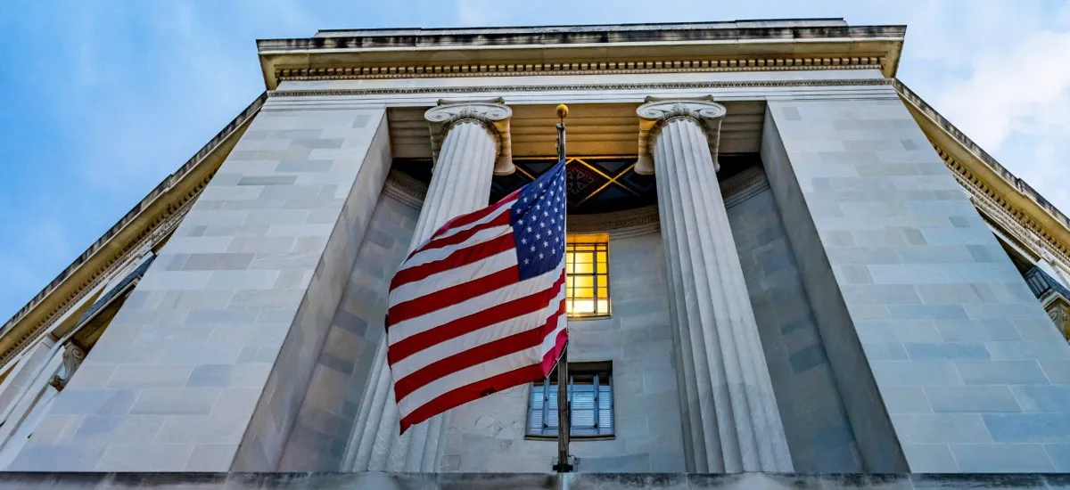 American flag flying in front of a federal building